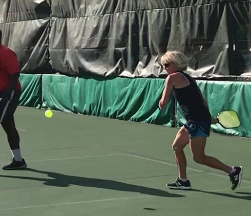 lady playing pickleball